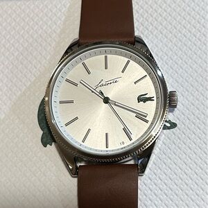 Lacoste Heritage Watch  With 42mm Silver Face With Brown Leather Band.
